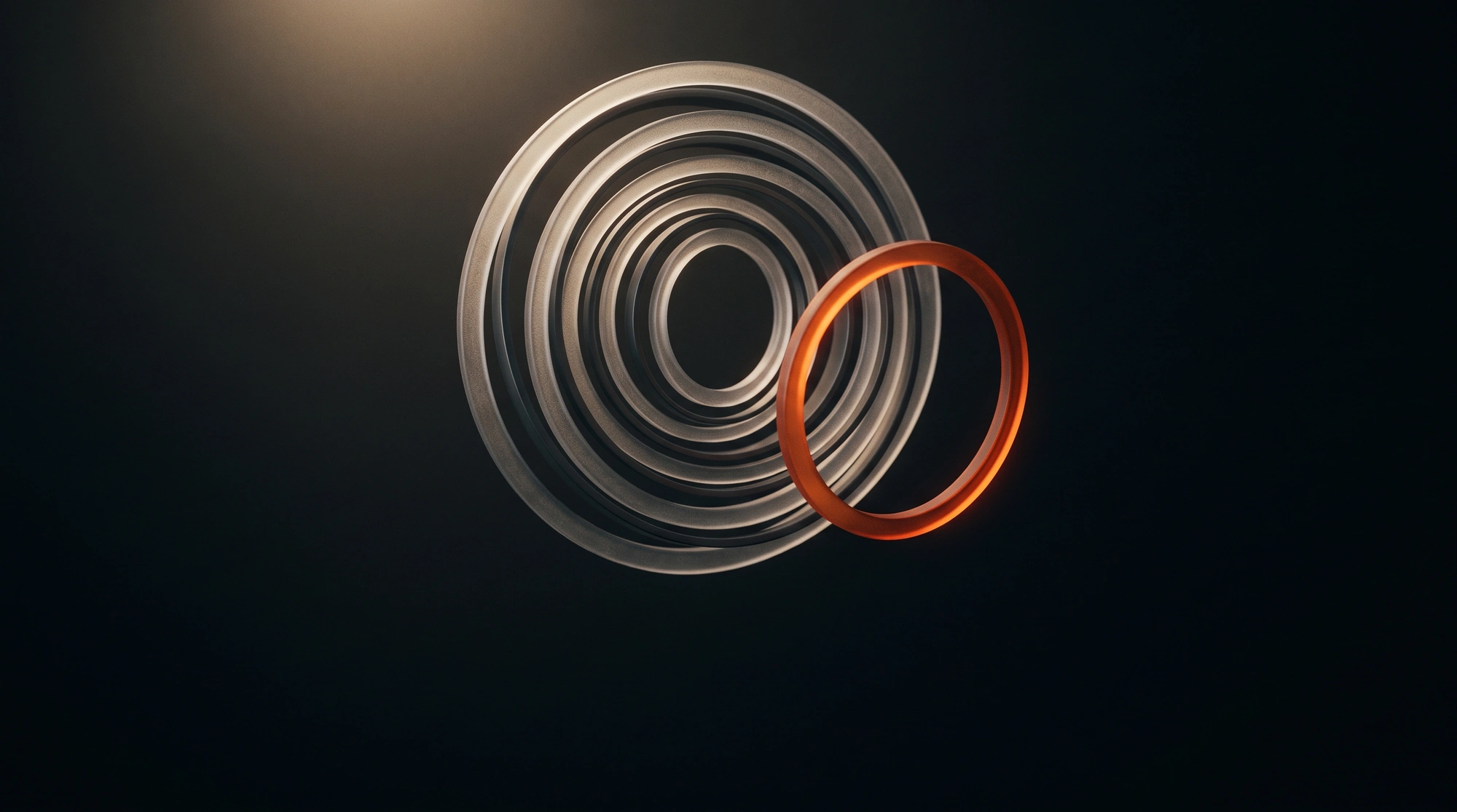 Abstract concentric glass rings with one ring highlighted.